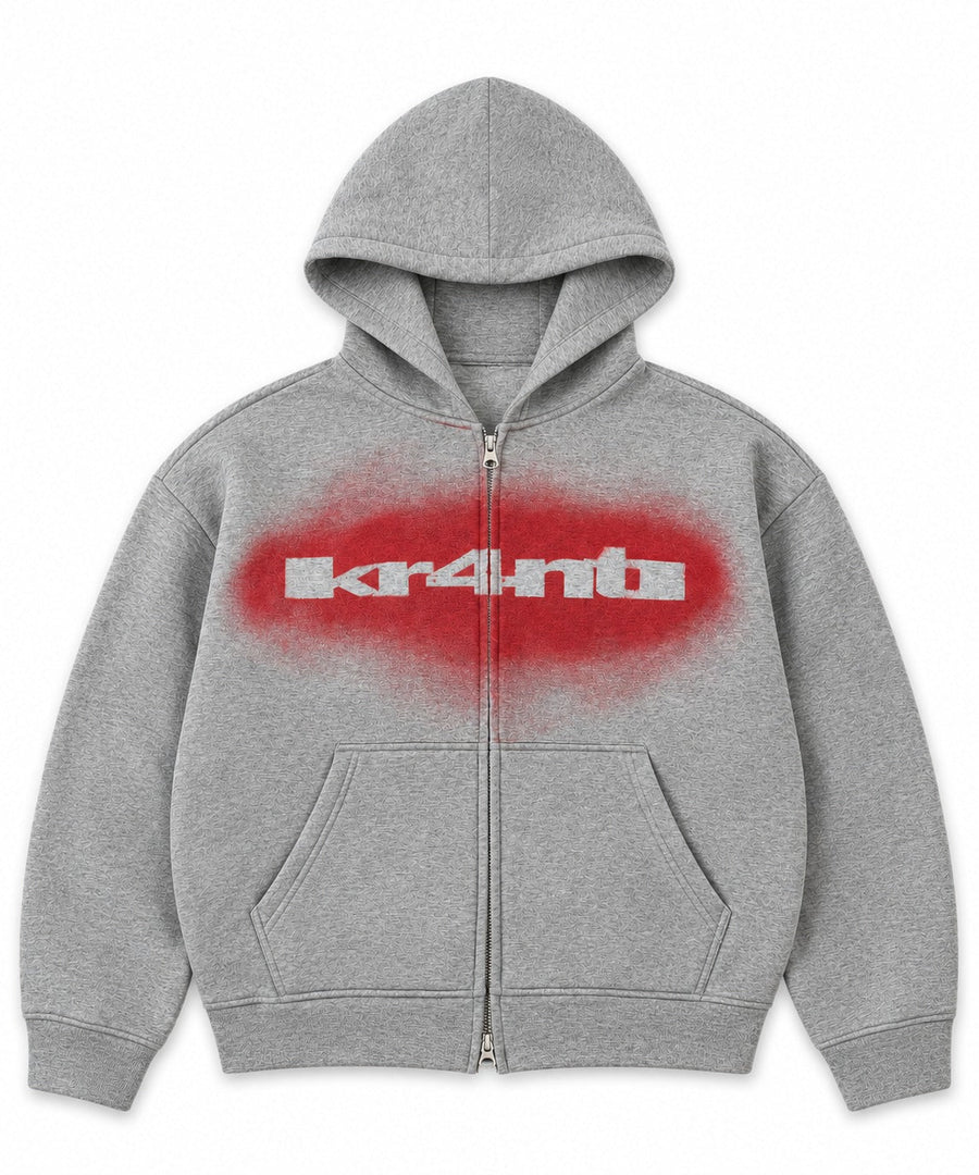 Grey boxy double-zip SPRAY PAINT STENCIL ZIPPER HOODIE with a red spray-painted kr4nti stencil on the chest